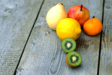 juicy bright fruits on old board