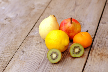 six fruits on an old gray pine board