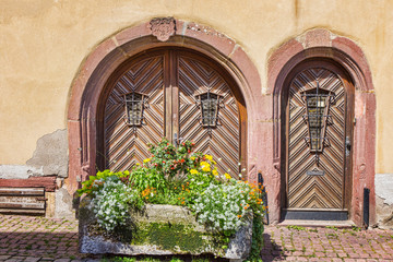Fototapeta na wymiar ..Entrance doors. The ancient city of Aegisheim. Wine Road Alsace. France.