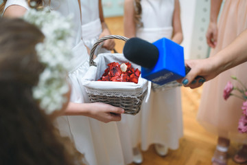 Girl with Basket and Woman with Microphone