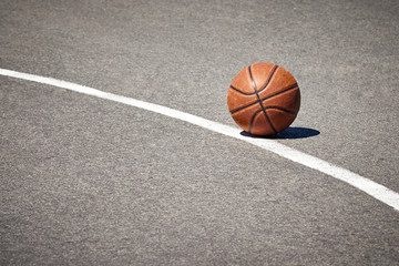 The basketball on the pavement