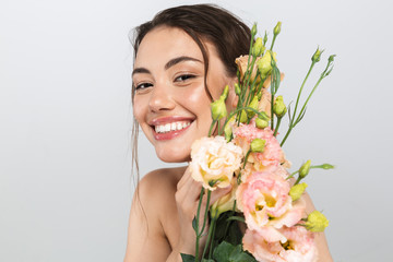 Beauty portrait of a smiling young topless woman