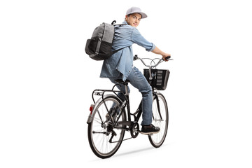 Teenager with a backpack riding a bicycle