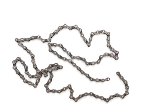Old dirty broken Bicycle chain on white background