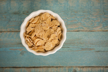 Cornflakes on wooden table