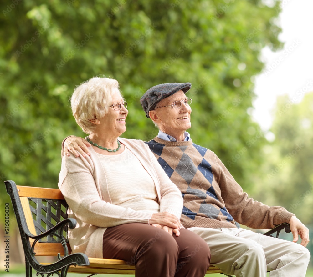 Canvas Prints Senior couple sitting on a bench