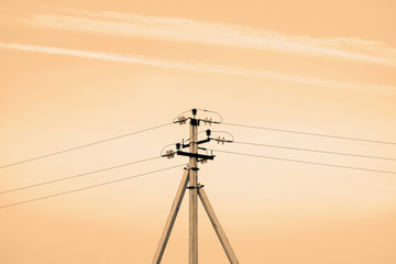 Power lines on background of sky close-up. Electric hub on pole in monochrome. Electricity...