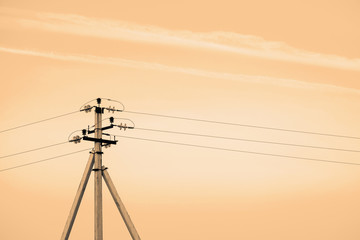 Power lines on background of sky close-up. Electric hub on pole in monochrome. Electricity...
