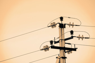 Power lines on background of sky close-up. Electric hub on pole in monochrome. Electricity...