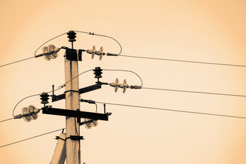 Power lines on background of sky close-up. Electric hub on pole in monochrome. Electricity...