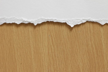 torn paper texture on wood background, copy space.
