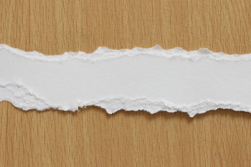 torn paper texture on wood background, copy space.