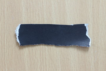 torn paper texture on wood background, copy space.