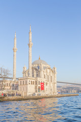 Fototapeta na wymiar Exterior view of Ortakoy Mosque with15 July Martyrs Bridge