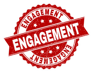 ENGAGEMENT seal imprint with corroded texture. Rubber seal imitation has round medal form and contains ribbon. Red vector rubber print of ENGAGEMENT caption with corroded texture.
