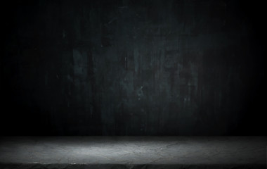 Dark room with tile floor and brick wall background