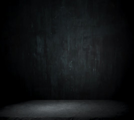 Dark room with tile floor and brick wall background