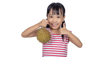 Asian Chinese little girl holding durian fruit with thumbs up