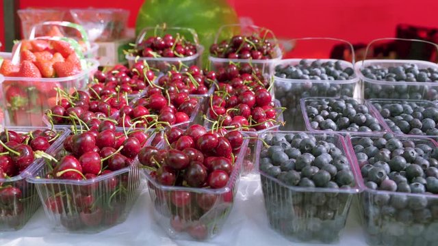 18635_Lots_of_berry_fruits_on_the_plastic_containers.mov