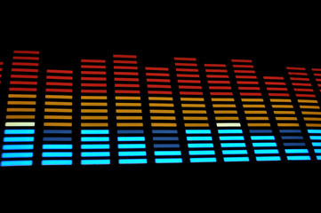 Stylish light panel of pixels, neon with blue or green, yellow and red, a bright equalizer in a...