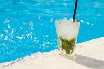 Mojito.Cocktail glasses at pool, beach side.