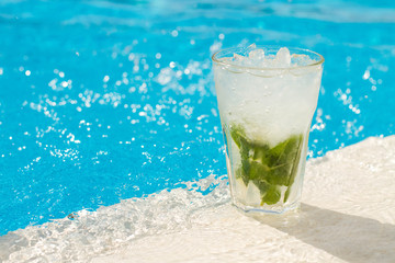 Mojito.Cocktail glasses at pool, beach side.