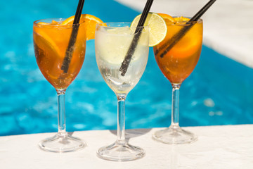Tropical cocktail on a pool background