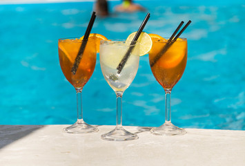 Tropical cocktail on a pool background