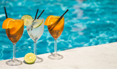 Tropical cocktail on a pool background