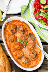 Beef meatballs with rice in tomato gravy with carrots