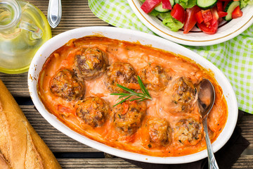 Beef meatballs with rice in tomato gravy with carrots