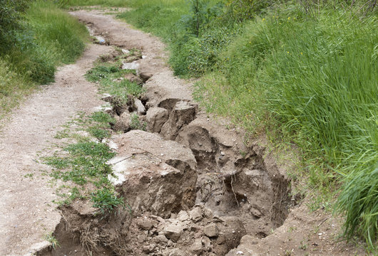Soil erosion after heavy rain on a mountain path