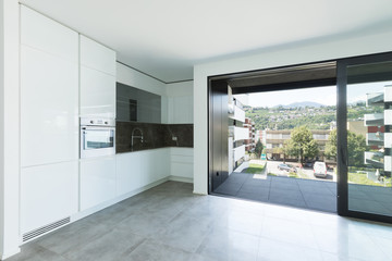 Fototapeta na wymiar Interiors of modern apartment, kitchen