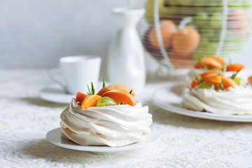 Homemade mini Pavlova, a meringue-based dessert with cream cheese and fruits
