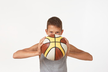 teenager with a basketball on a white background.