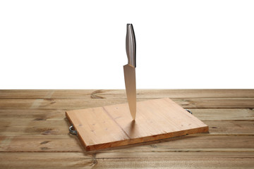 chopping board on a wooden table with a knife isolated on white background with clipping path and copy space
