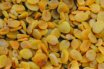 Dried fruit background. Rows of dried apricots
