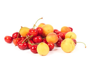 Fresh delicious apricot and cherries isolated on white background