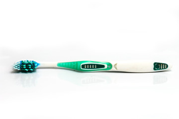 used green,white toothbrush  isolated on white background