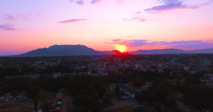 Aerial clip of Morogoro Town during sunset. Strong Presence of colours like red and violet.