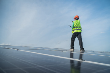 engineer working on maintenance panel in solar power plant