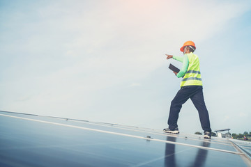 engineer working on maintenance panel in solar power plant