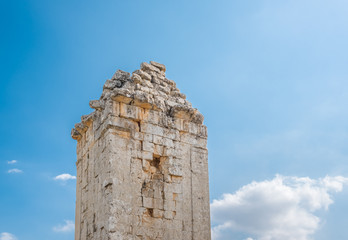 Fototapeta na wymiar With blue sky on background,View of Hellenics Memorial Tomb located in Uzuncaburc,Silifke,Mersin,Turkey