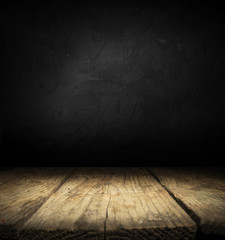 Dark room with tile floor and brick wall background