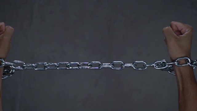 Freedom, concept of free man, broken chain in slow motion