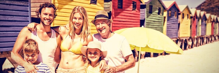 Portrait of multi-generated family standing at beach