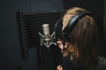 little girl singing in recording studio