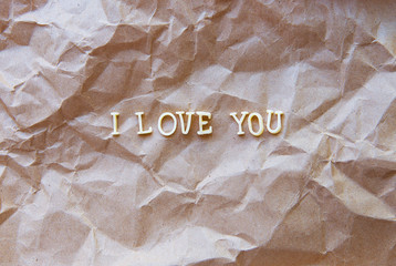 I love you written on kraft paper.