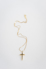 Golden cross on marble background © SianStock