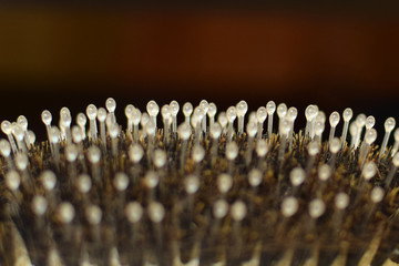 Extreme close up shot of comb details. massage hairbrush. Comb macro shot of masseur side